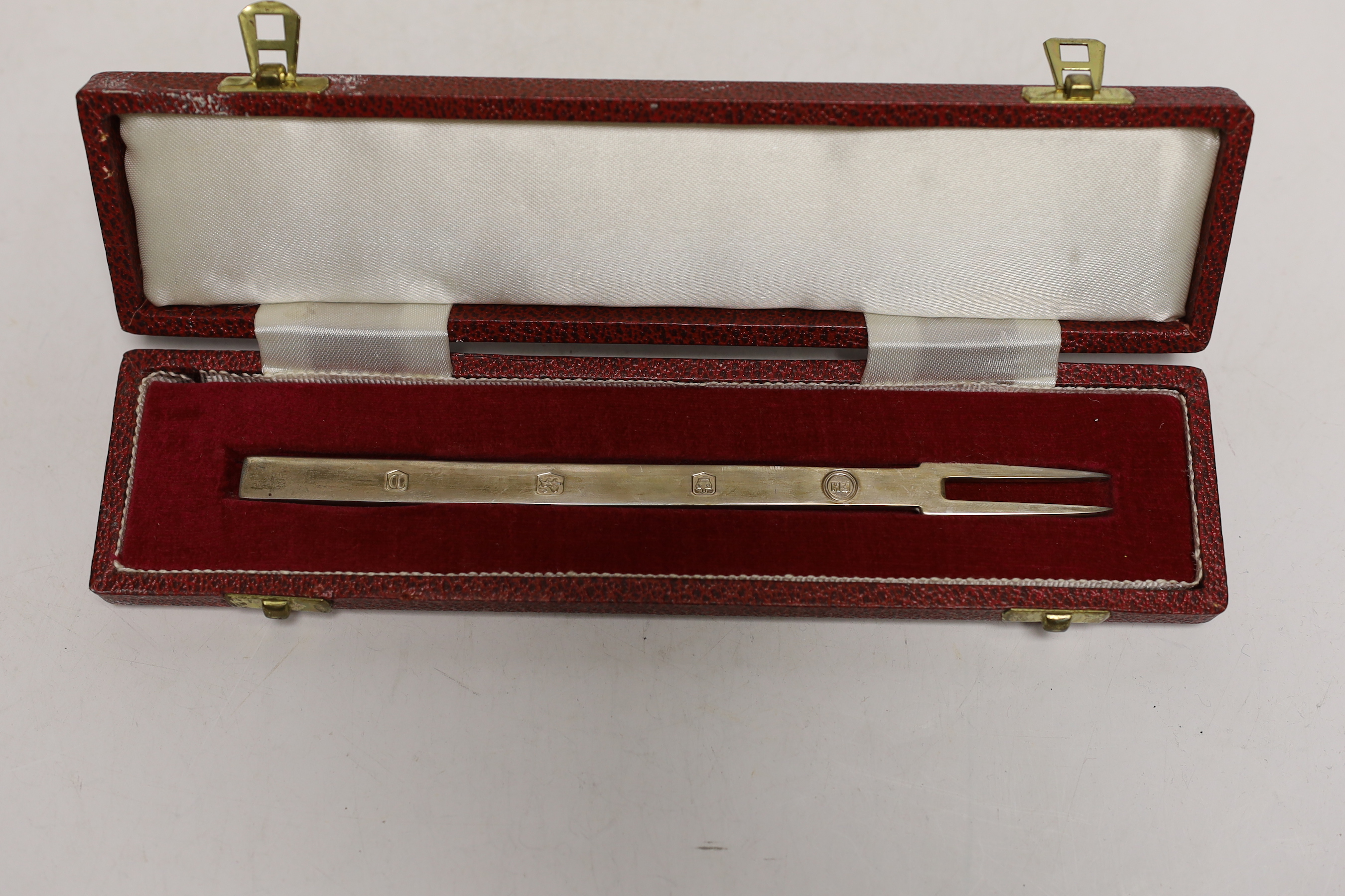 A cased set of twelve George V Liberty & Co silver coffee spoons, with gem set terminals including amethyst, malachite and carnelian, Birmingham, 1927, 93mm, in Liberty & Co box.